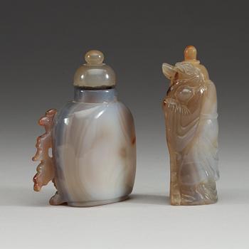 Two Chinese agate snuff bottles with stoppers.