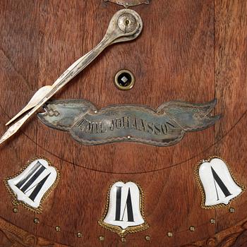 A lacquerwork wall pendulum clock, late 19th Century.