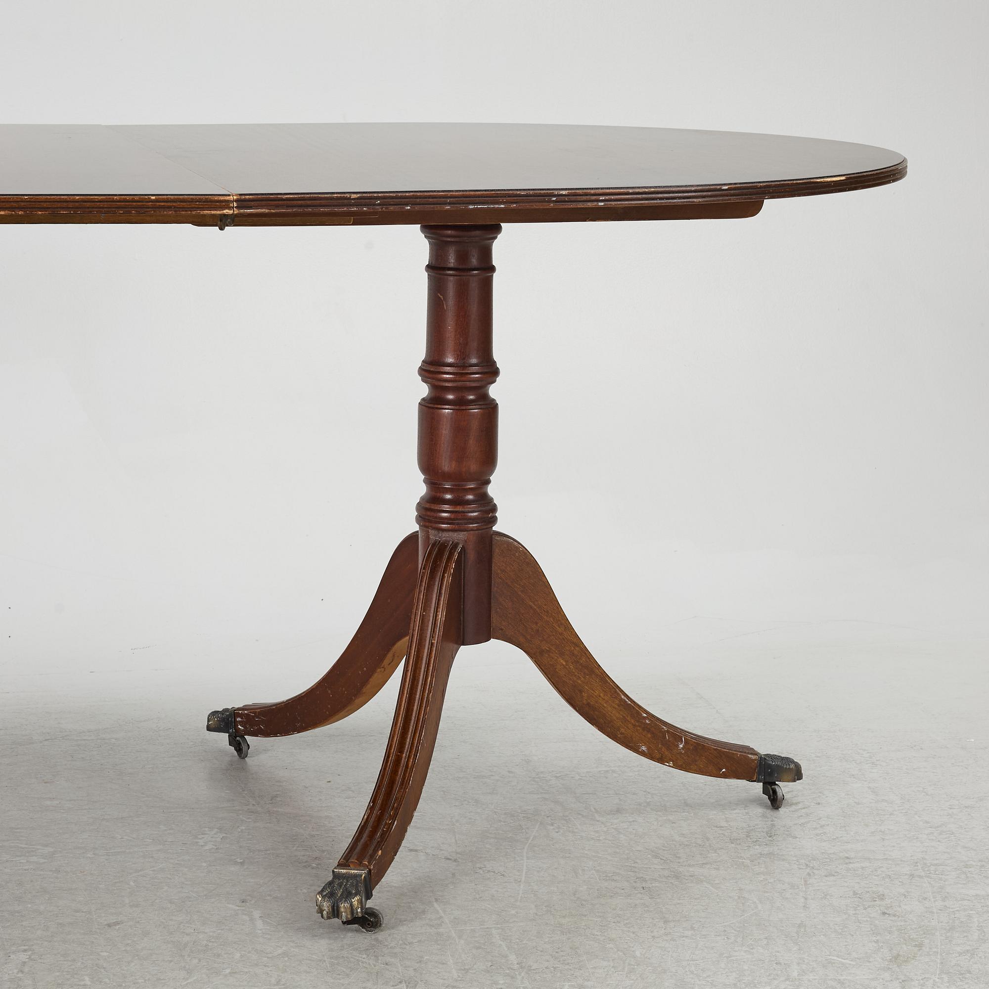 A dining table, 20th century, England.
