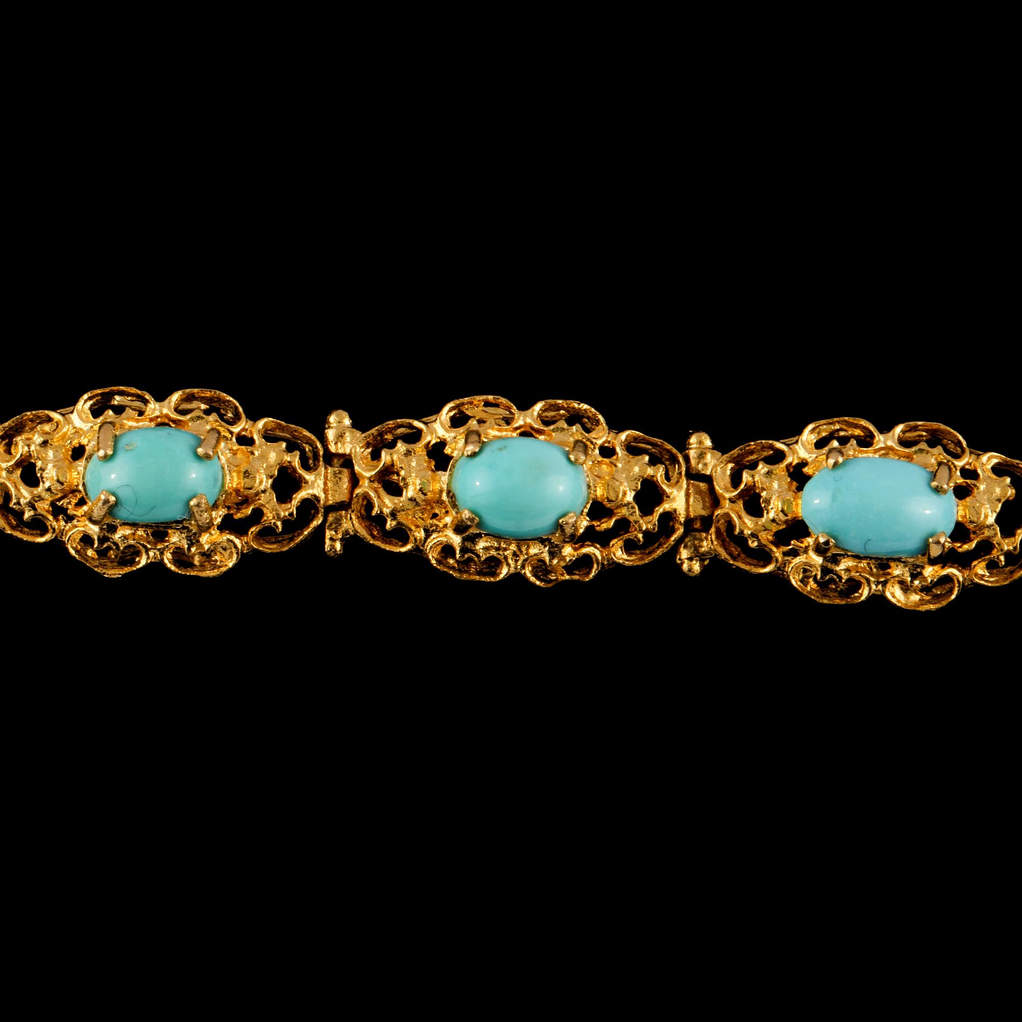 ARMLÄNK, 18k guld med 11 cabochonslipade turkoser, utländska stämplar. Vikt 20 g.