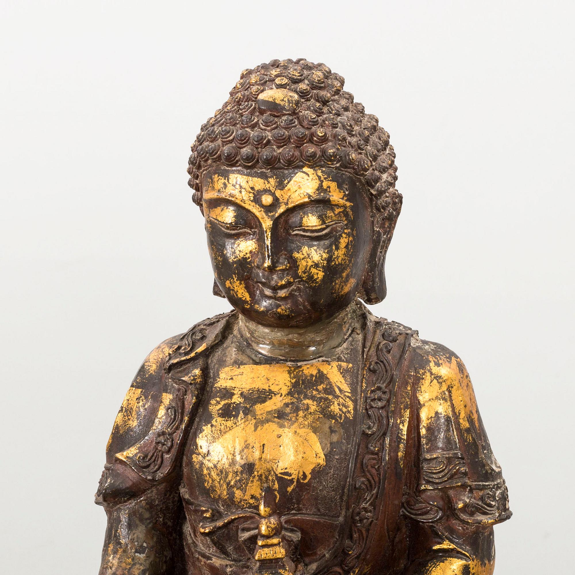 A Ming style gilded bronze Buddha.
