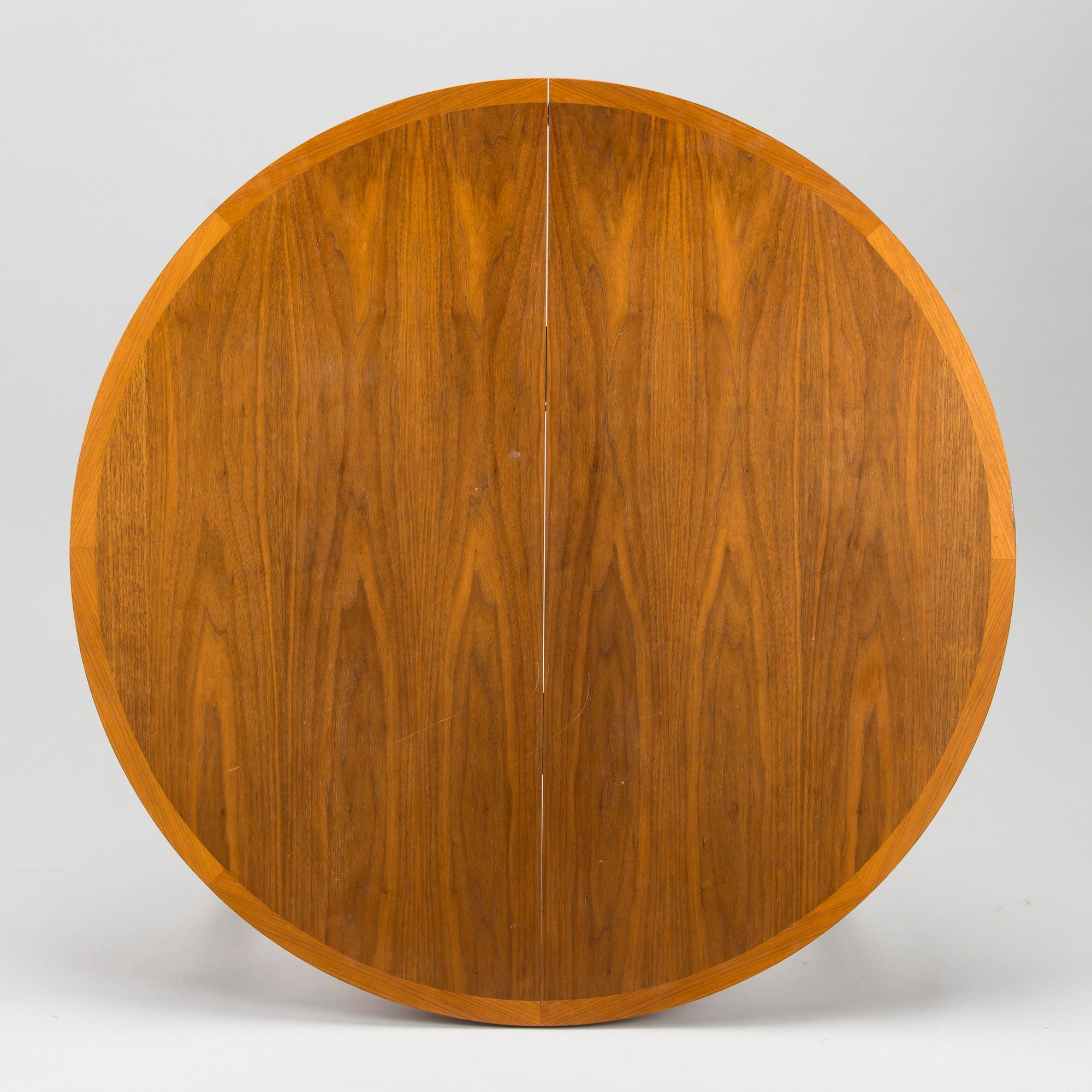 A 1960s teak and oak dining table.