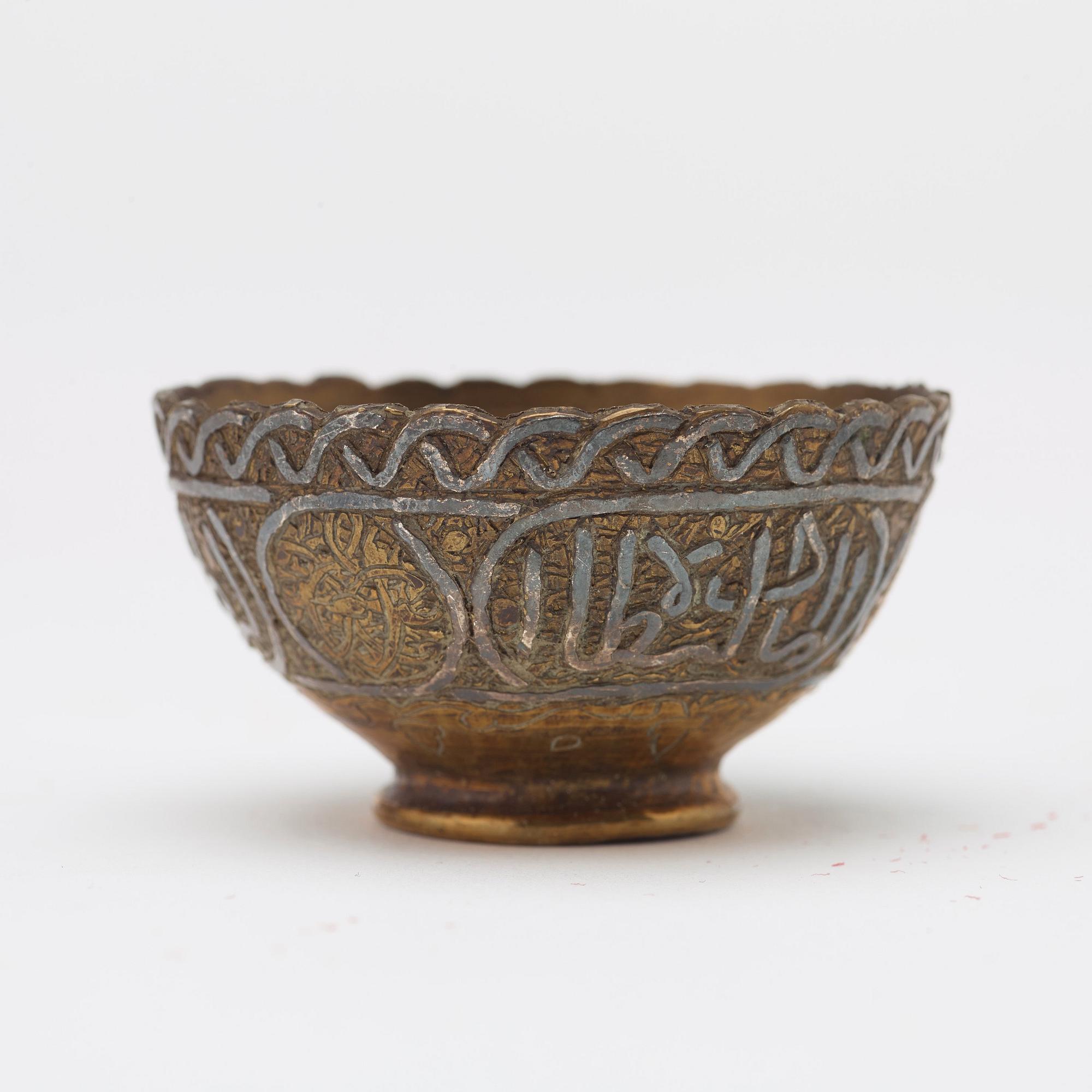 ZARFS, 12 PIECES. Metal. Height ca 3,5 cm each. Iran/Turkey, around 1900 - first half of the 20th century.
