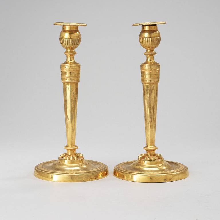 A pair of French Empire early 19th Century candlesticks.