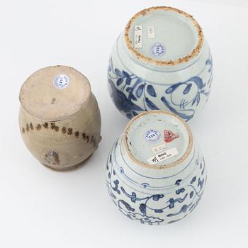 Five blue and white porcelain and ceramic urns, Ming dynasty, (1368-1644).