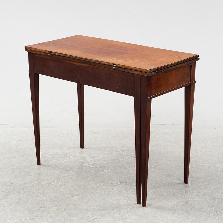 A mahogany-veneered Empire cards table, fist part of the 19th Century.