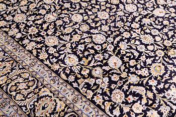 A carpet, Kashan, signed, ca 410 x 292 cm.