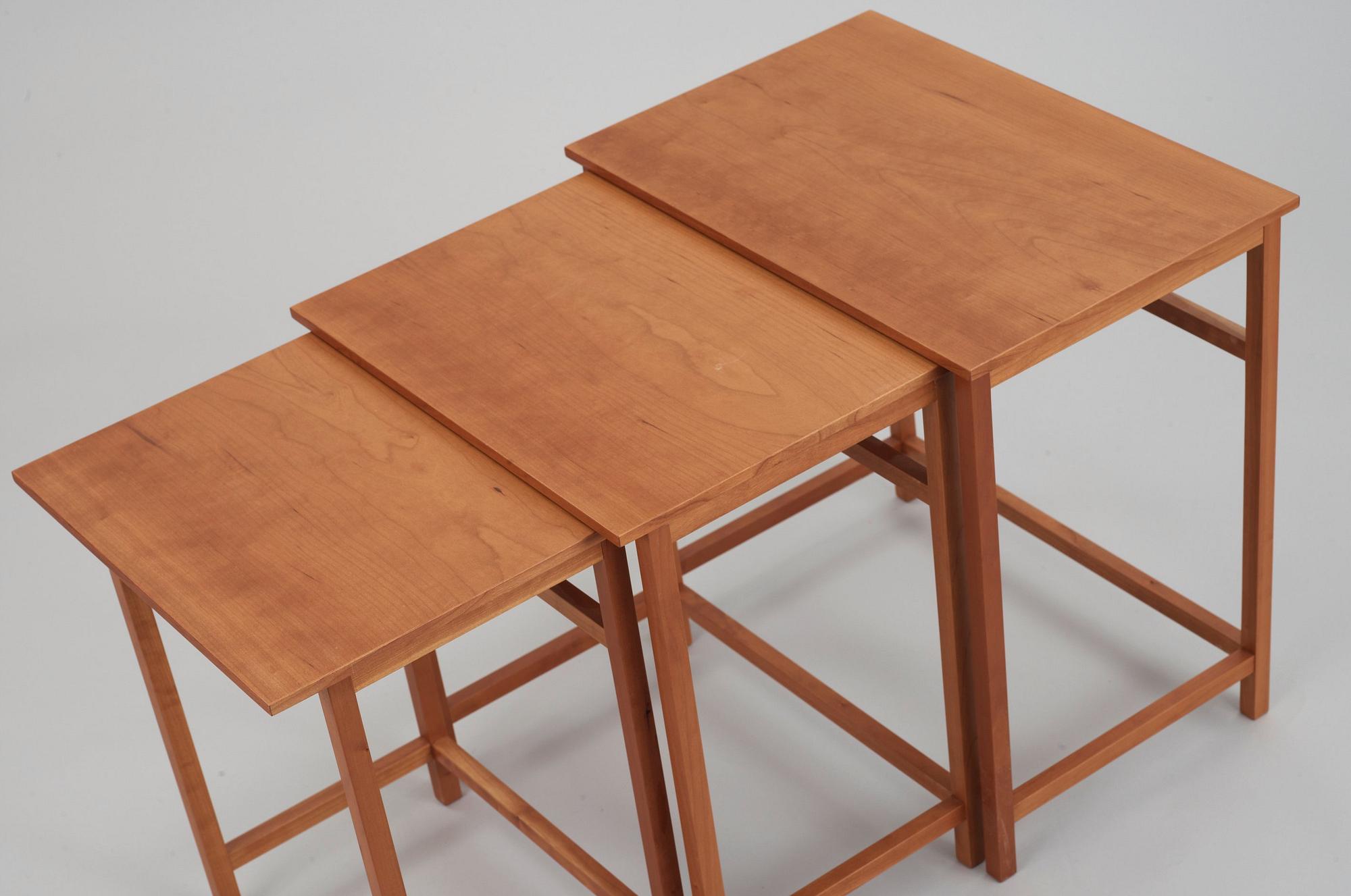 A Josef Frank mahogany set of occasional tables, Svenskt Tenn, model 618.