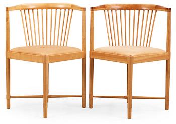 A pair of Børge Mogensen 'Ruder Konge' cherry and beige leather chairs, Søborg Møbelfabrik, Denmark.