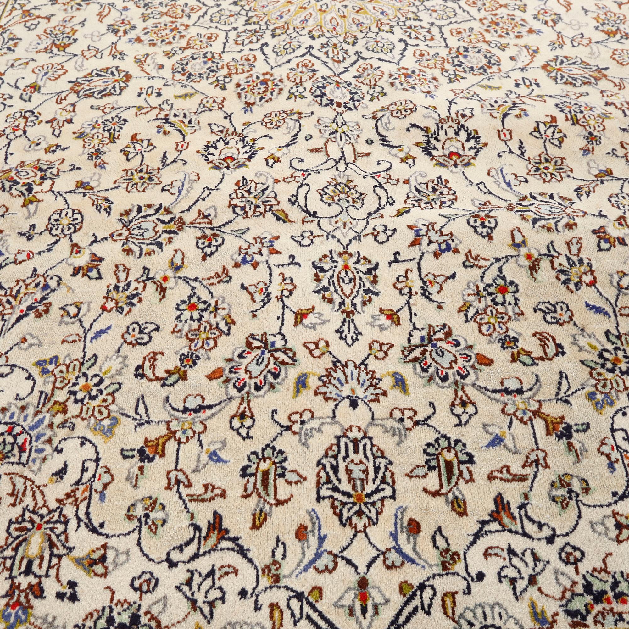 A Keshan rug, 340 x 236 cm.
