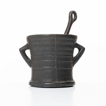 Mortar and pestle, dated 1673.