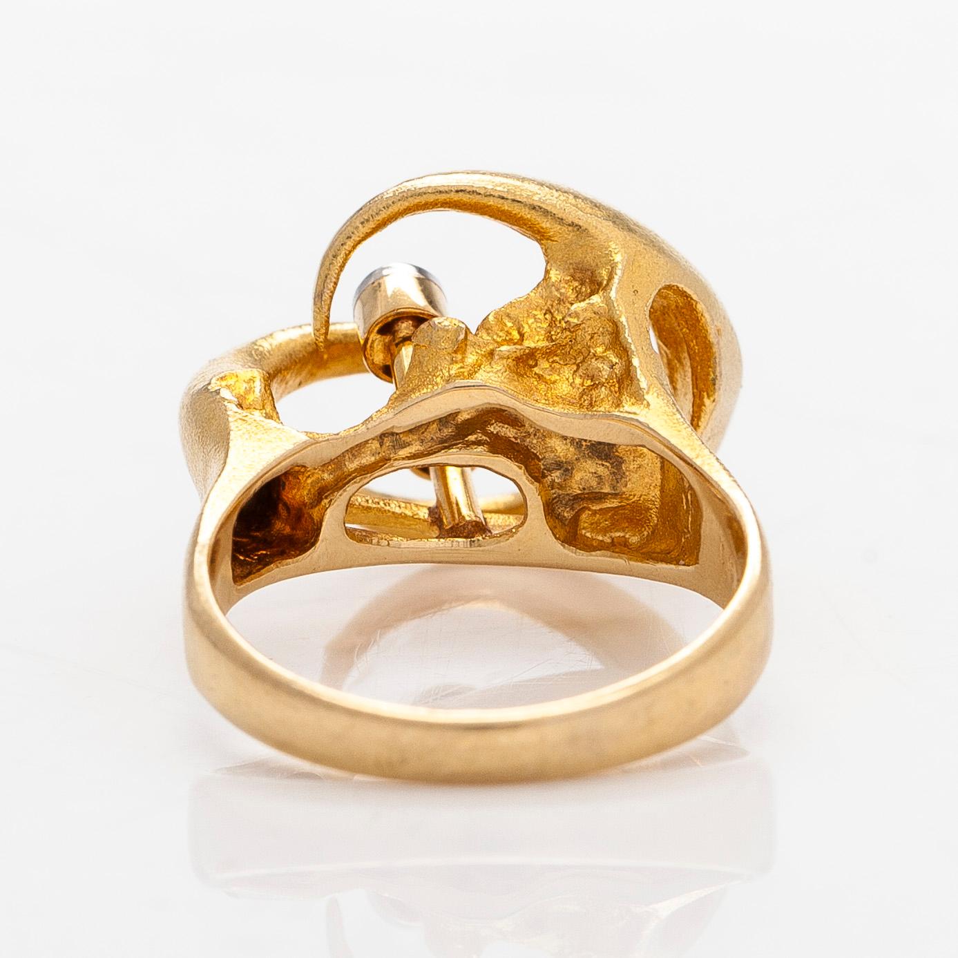 Björn Weckström, An 18K gold ring, with octagon-cut diamonds totalling ca 0.06 ct according to engraving, Lapponia 1975.