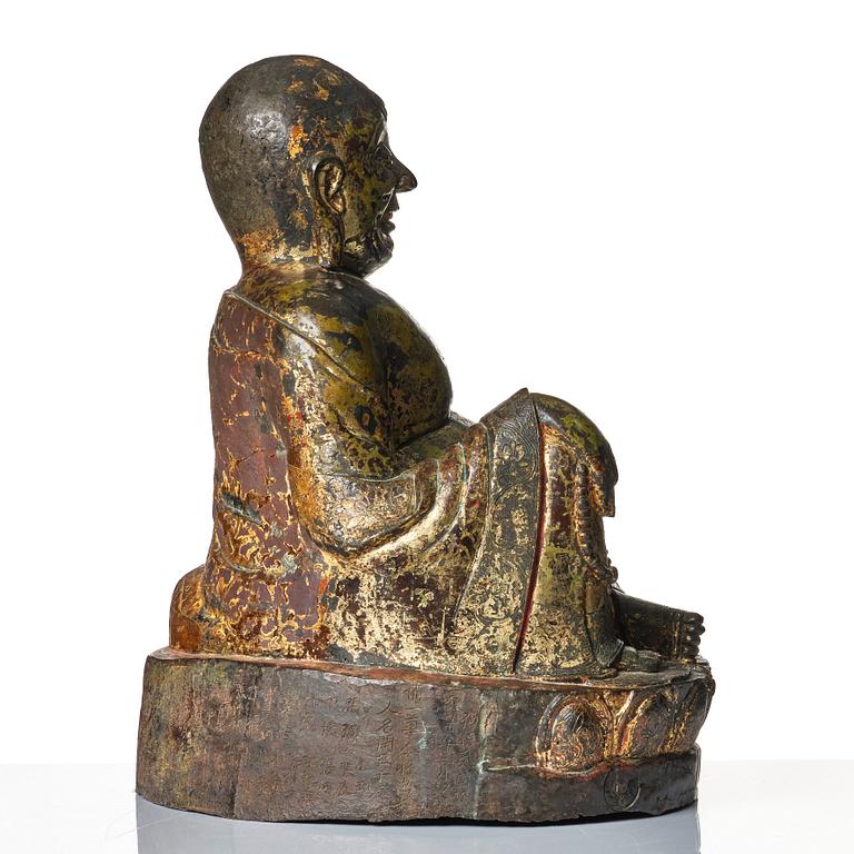 A large seated bronze figure of Budai, Ming Dynasty, dated to the fifth year of Jiajing (1526).