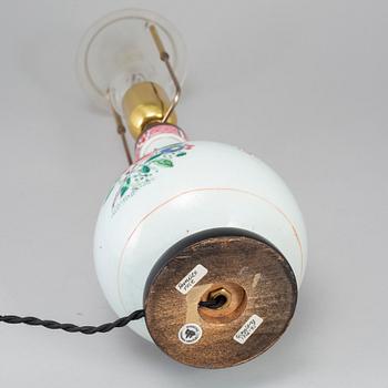 A famille rose bottle vase, Qing dynasty, 18th Century. Mounted as a lamp.