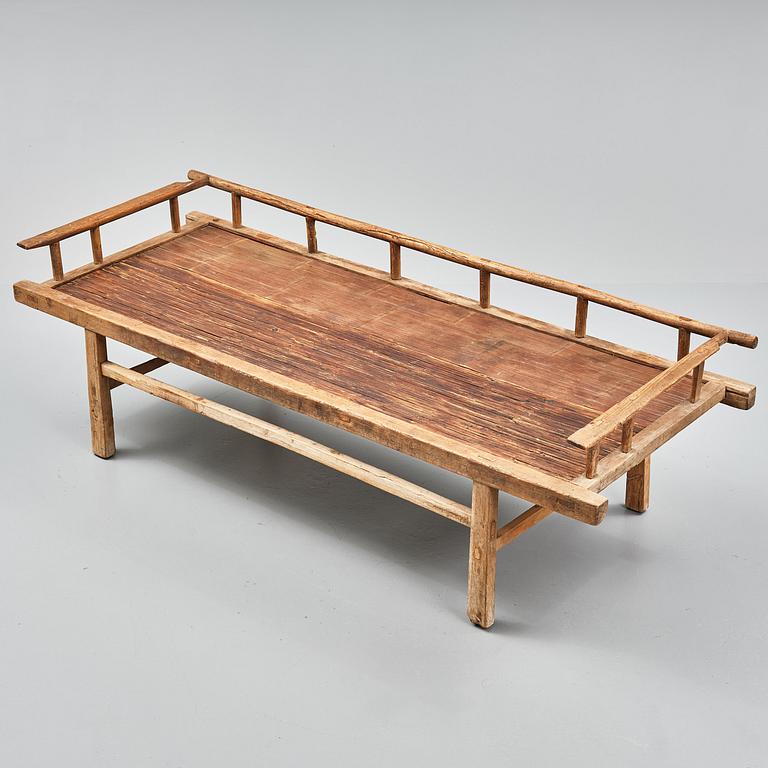 A wooden daybed, South East Asia.