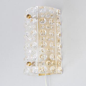 CARL FAGERLUND, a brass and glass Orrefors wall light, and a pait of wall lamps, unknown designer, 1960/70s.