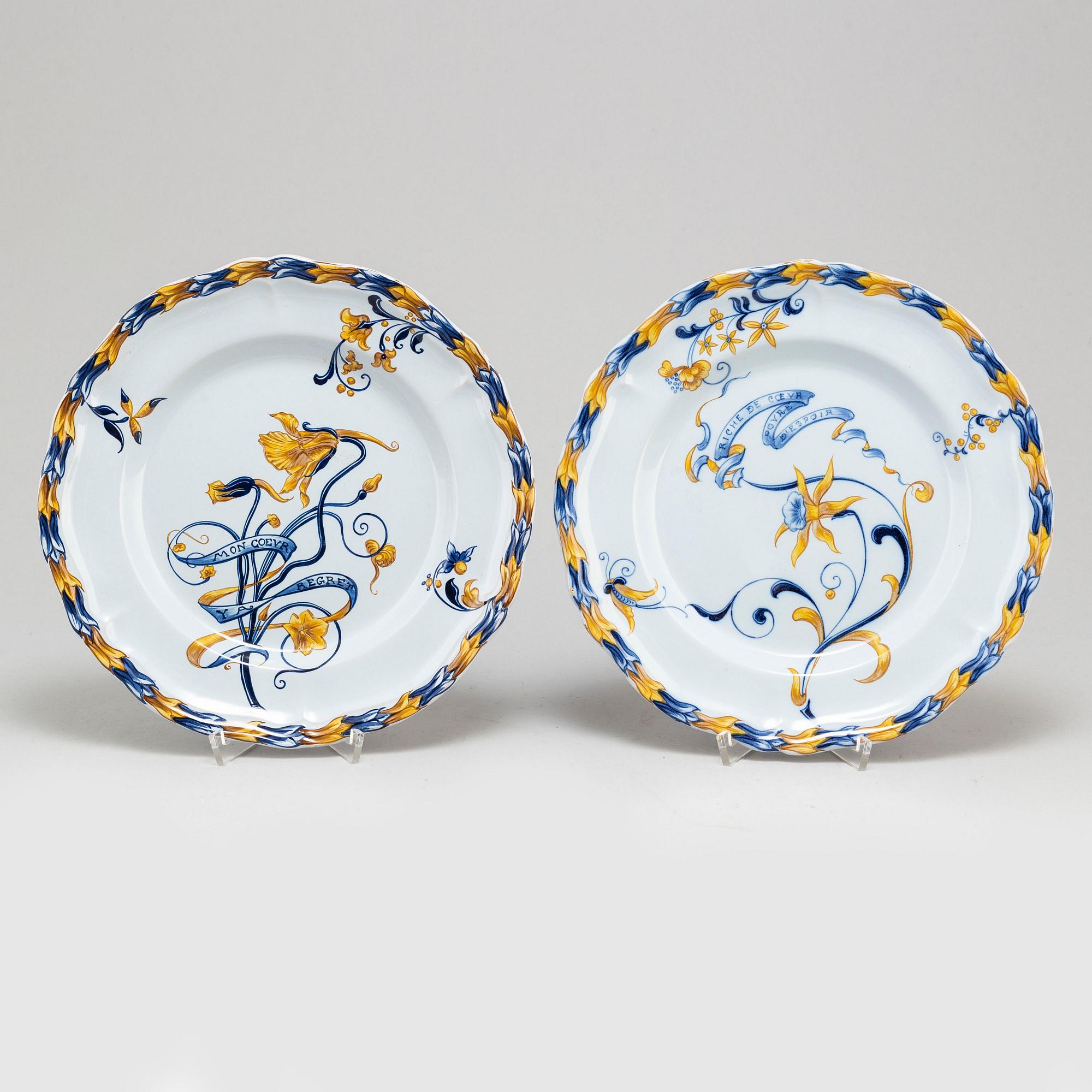 A set of four french faience cabinet plates signed Emile Gallé, Nancy. C. 1900.