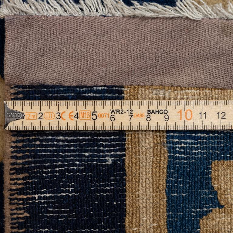 An antique Peking carpet, north China, c. 438 x 373 cm.