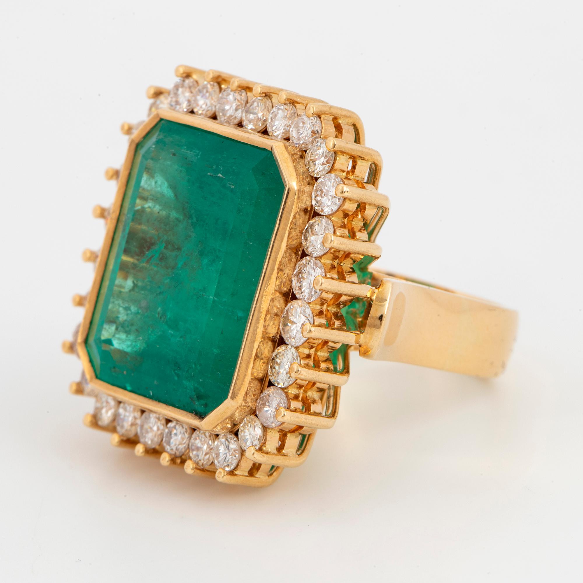 Large emerald-cut emerald and brilliant-cut diamond cocktail ring.