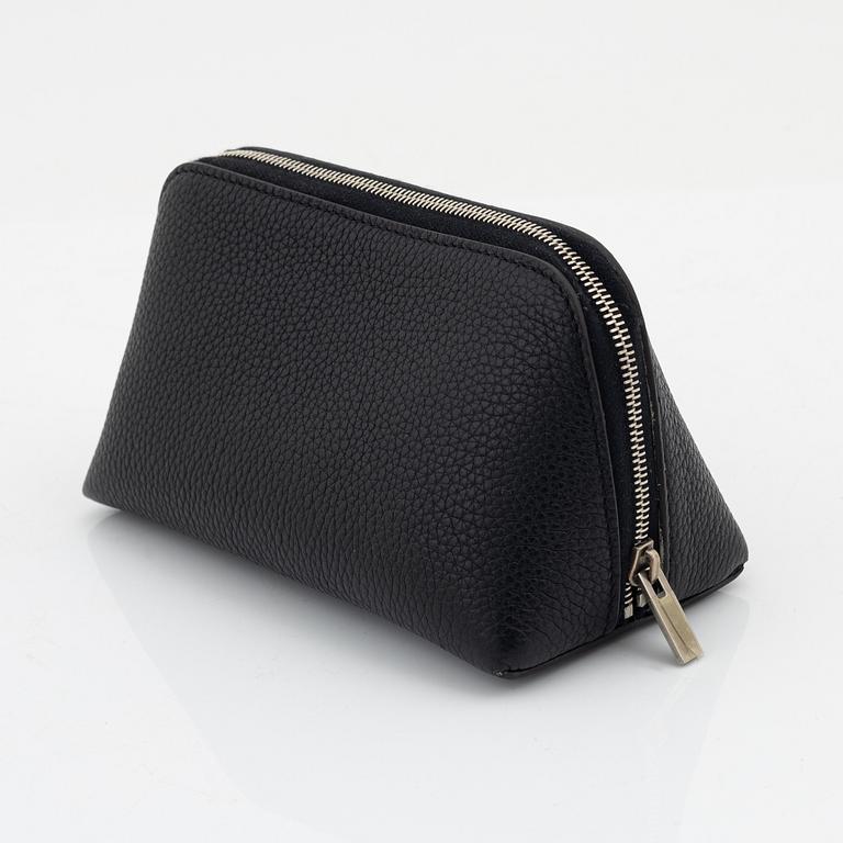 Céline, A small cosmetic pouch in black leather.