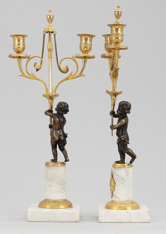 A pair of late Gustavian two-light candelabra.