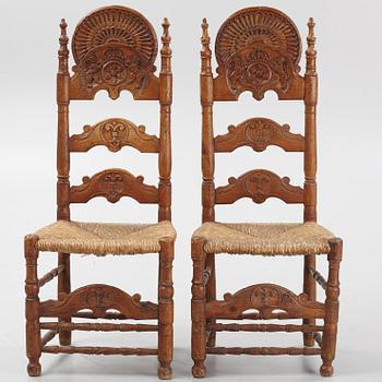 A pair of Spanish colonial style ladder-back chairs, circa 1900.