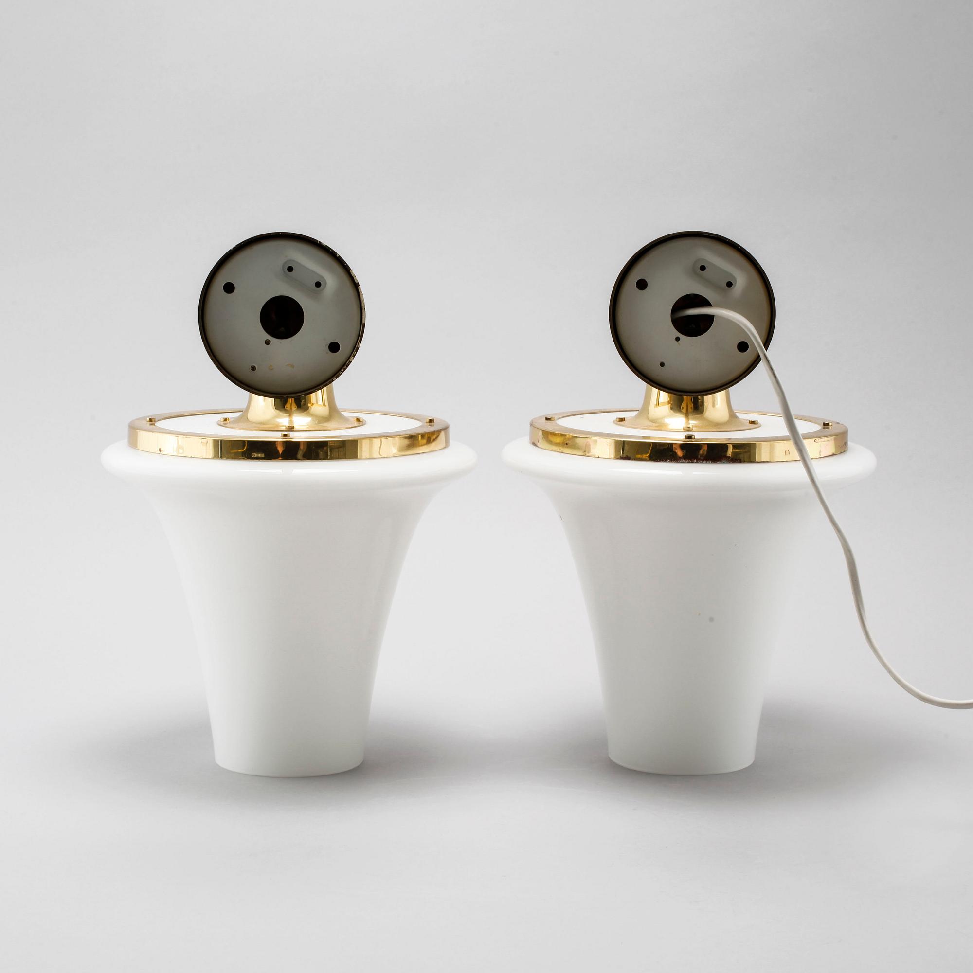 A pair of wall lamps designed by Hans-Agne Jakobsson, Markaryd, from the fourth quarter of the 20th century.