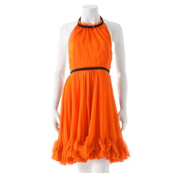 824. DOLCE & GABBANA, an orange silk cocktail dress.