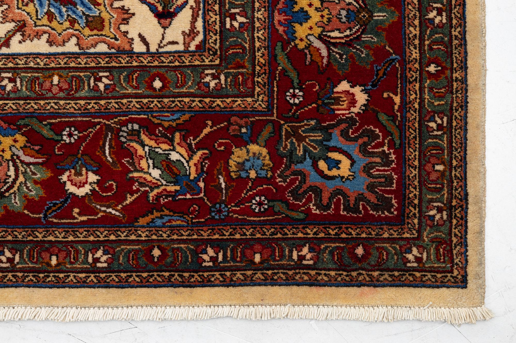 A Tabriz carpet, Northwestern Iran, of Safavid 'palmette' design, c, 483 x 302 cm.