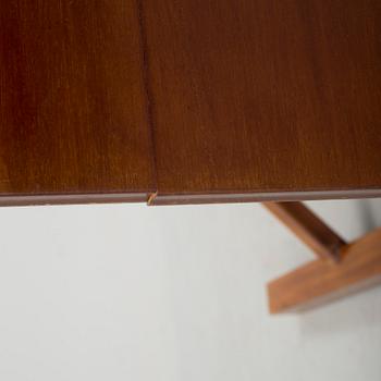 A mid 20th century mahogany veneered table from Nordiska Kompaniet (NK).