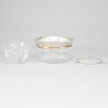 LES MUST DE CARTIER, a sterling silver and glass caviar bowl, Paris, France.