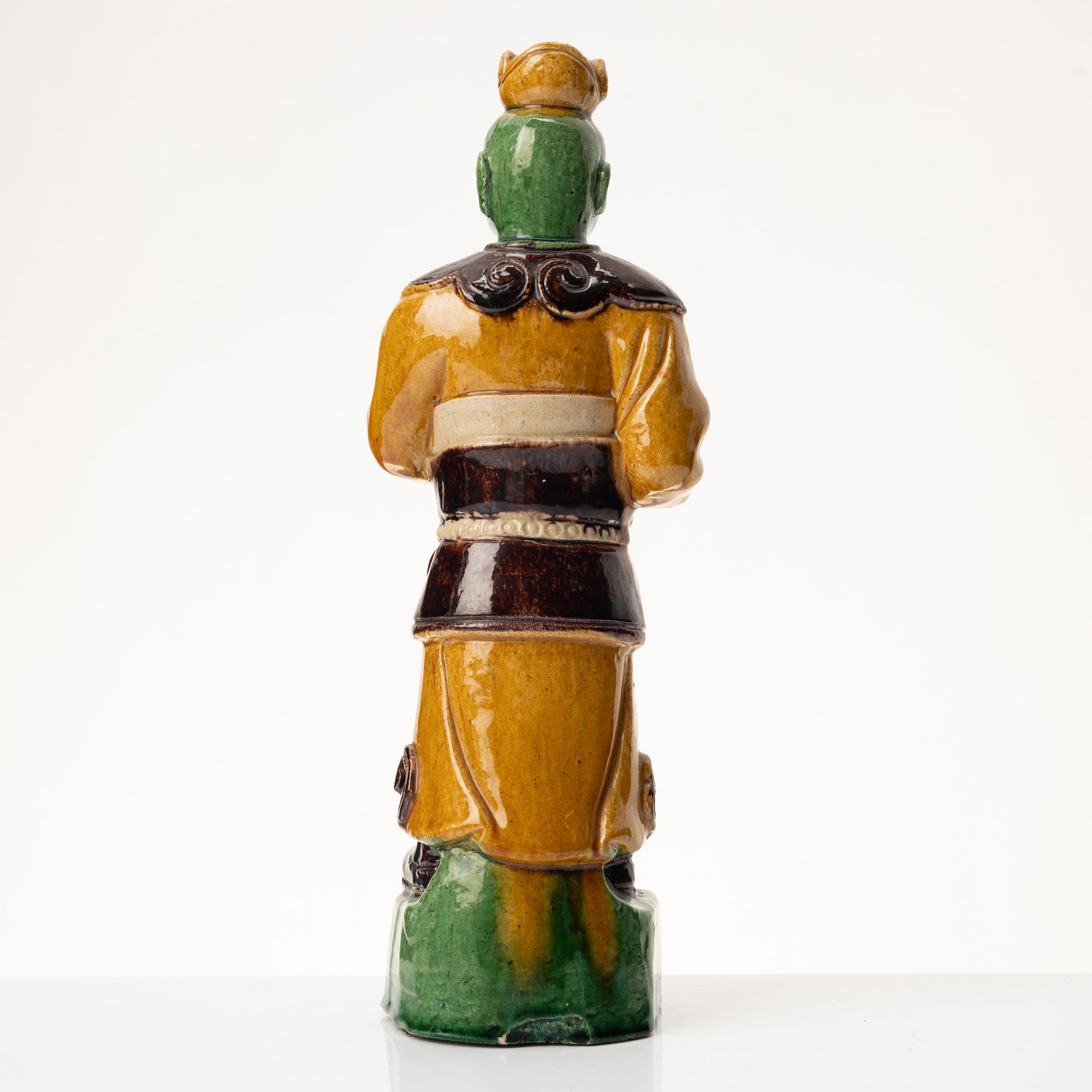 A stoneware figurine, China, Ming style but 20th century.