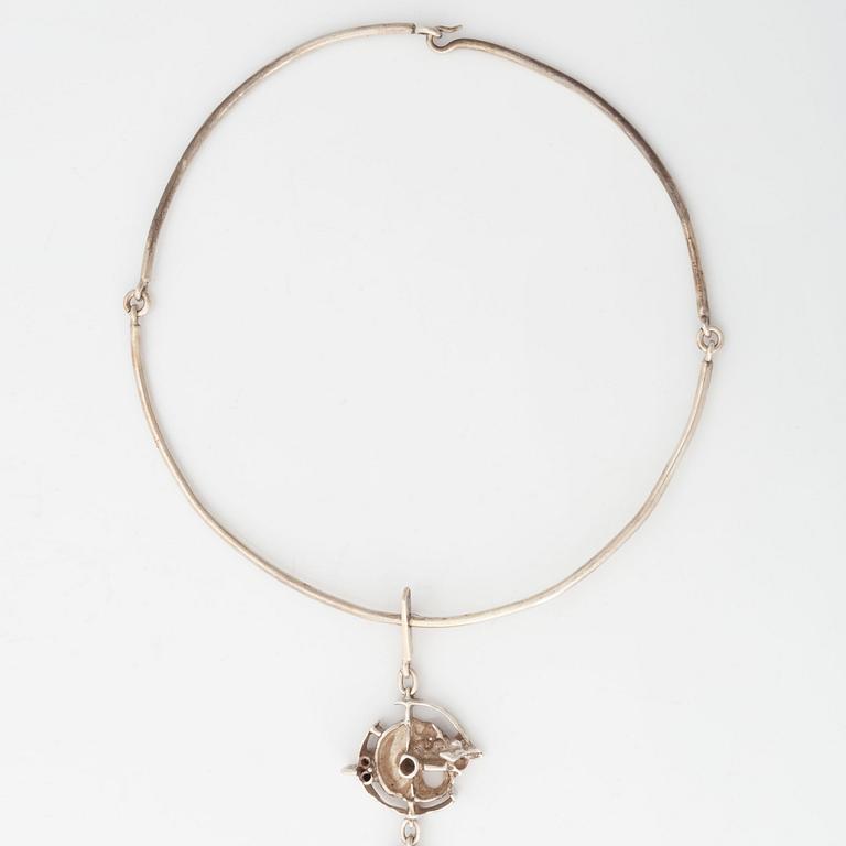 Juhls silver necklace.