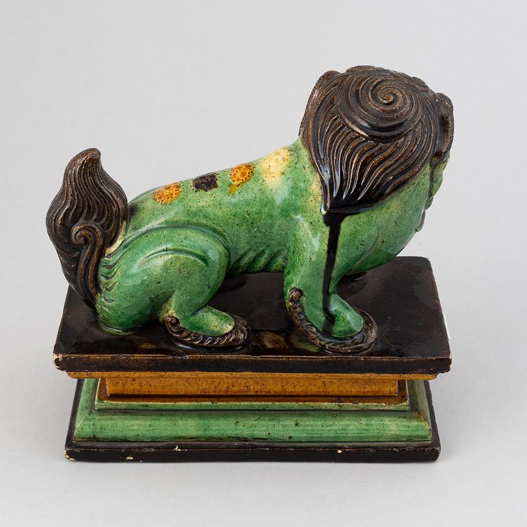 A green and yellow glazed buddhist lion, Qing dynasty, 19th Century.