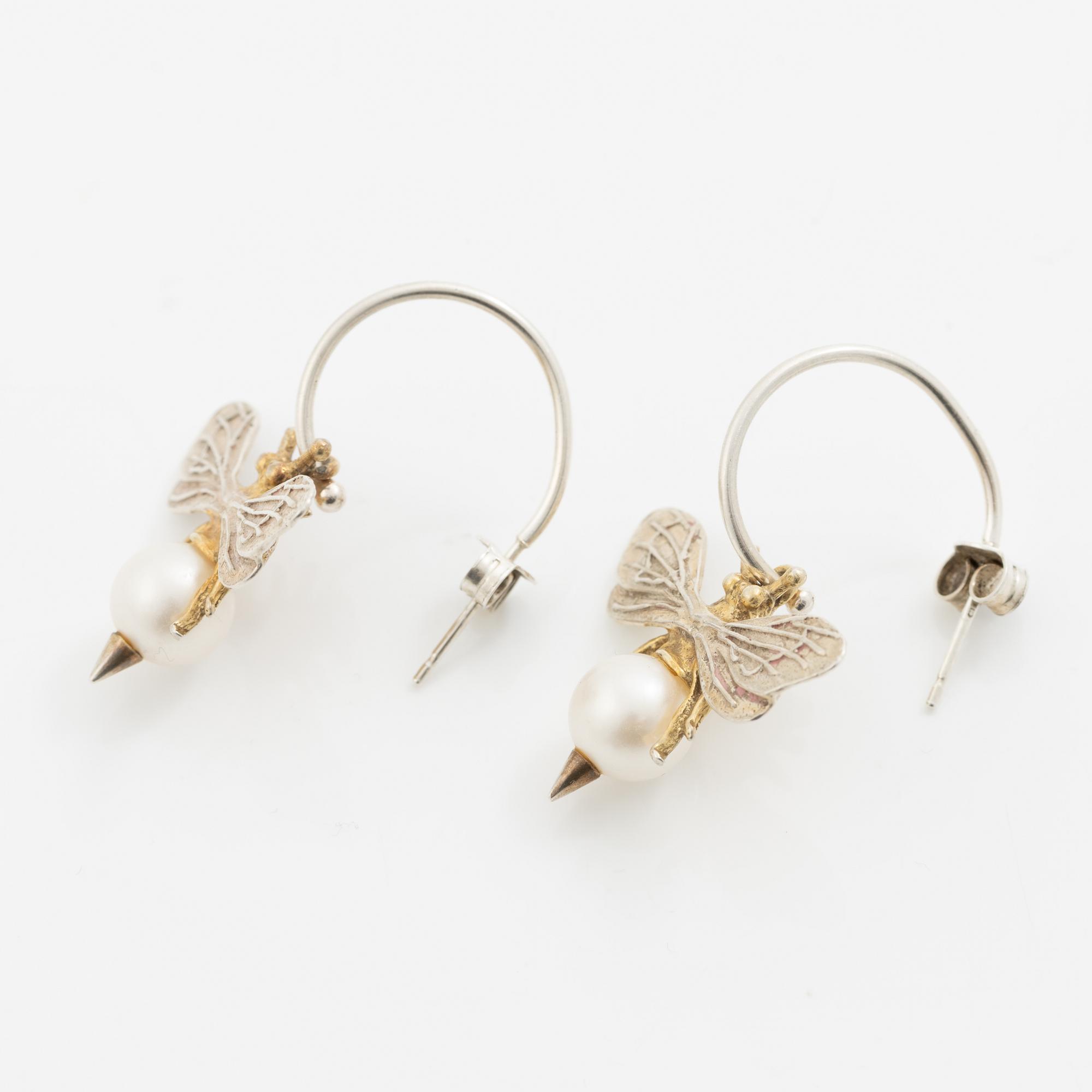 Maria Nilsdotter, a single earring, "rain earring" and a pair, silver with pearls and quartz.
