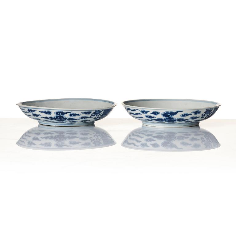 A pair of blue and white 'Phoenix dishes', Qing dynasty with Guangxu six character mark and of the period (1875-1908).