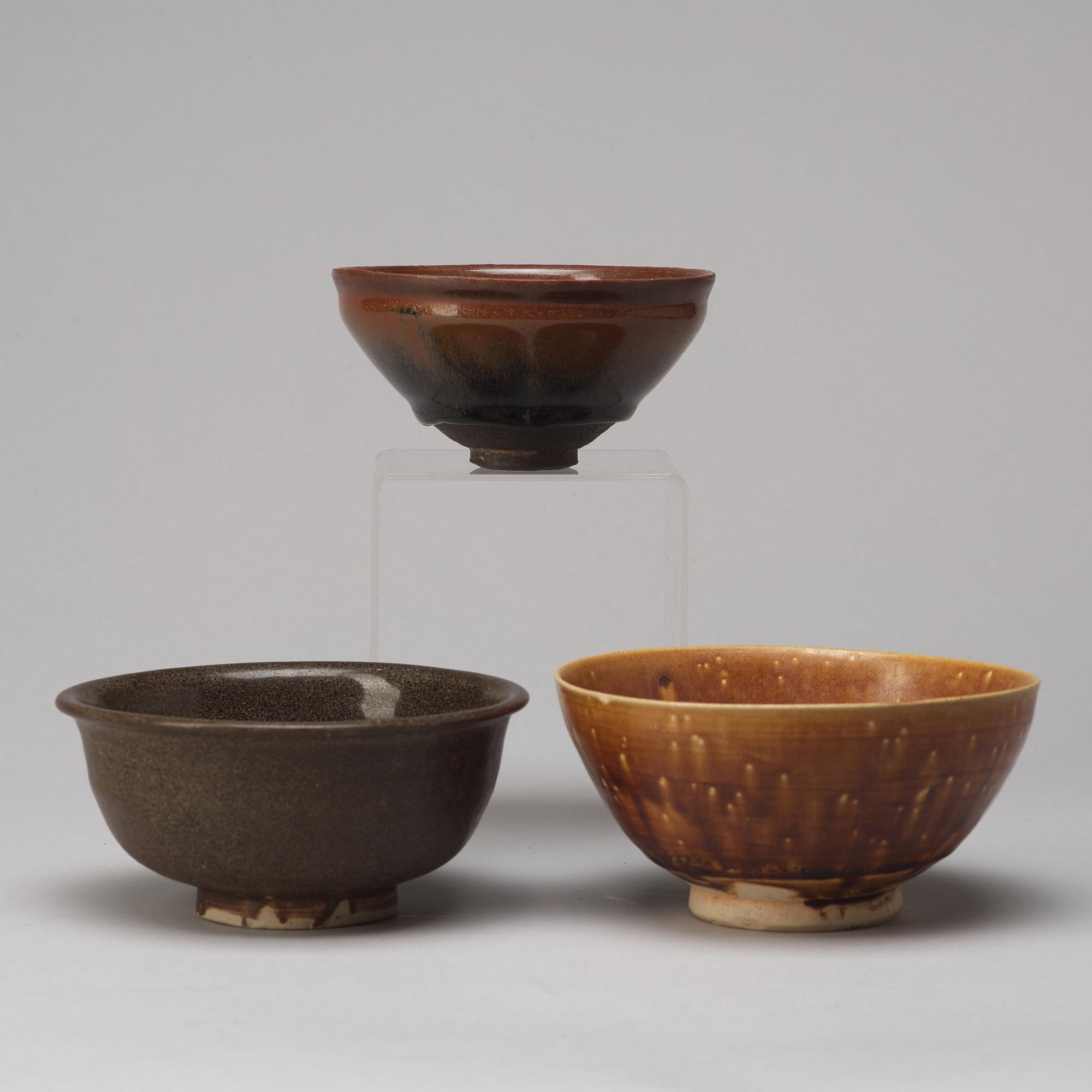 A group of three brown glazed bowls, China, 20th Century.