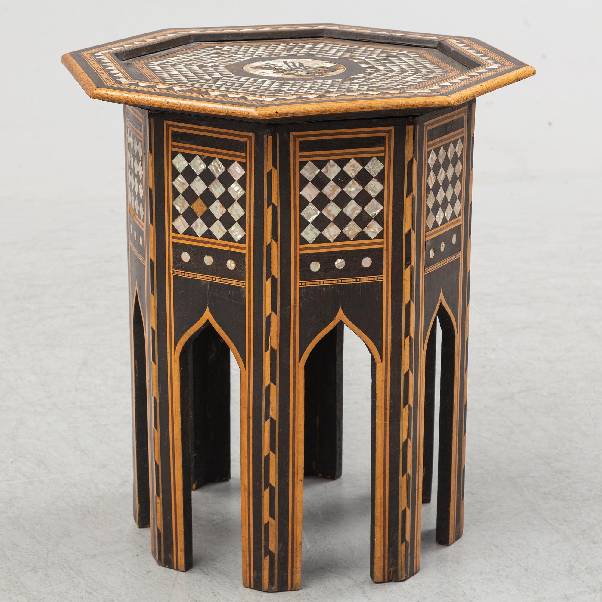 A mother of pearl and wood small table, 20th century.