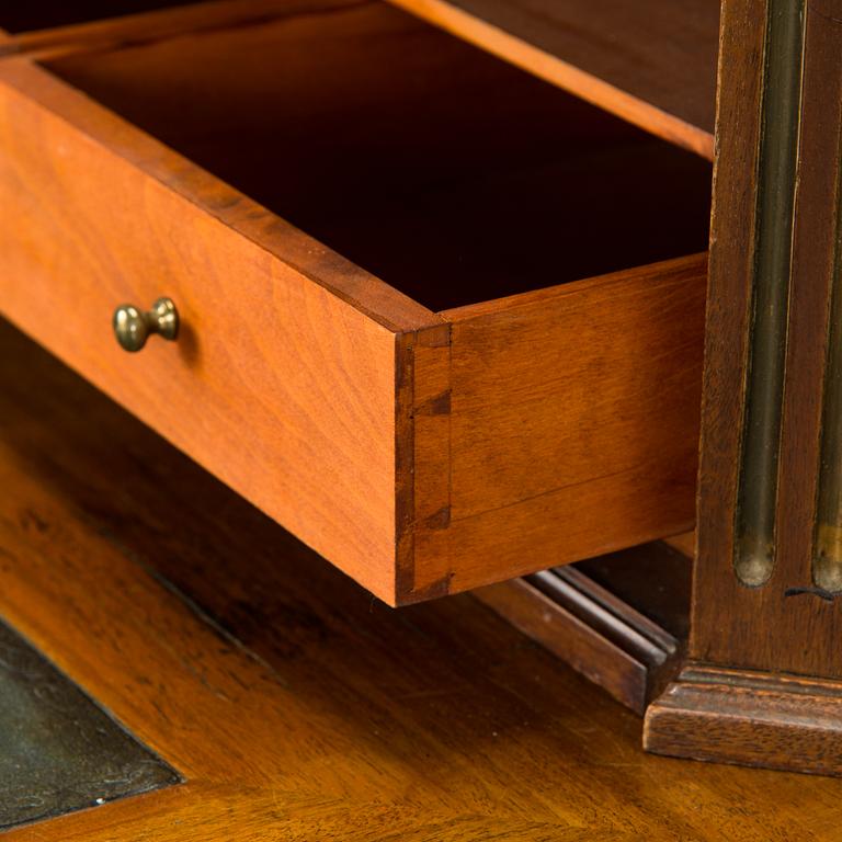 A 20th-century Louis XVI style mahogany veneered writing desk.