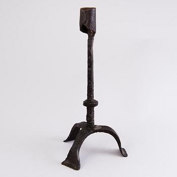 A CANDLESTICK, iron, 18th century or older.