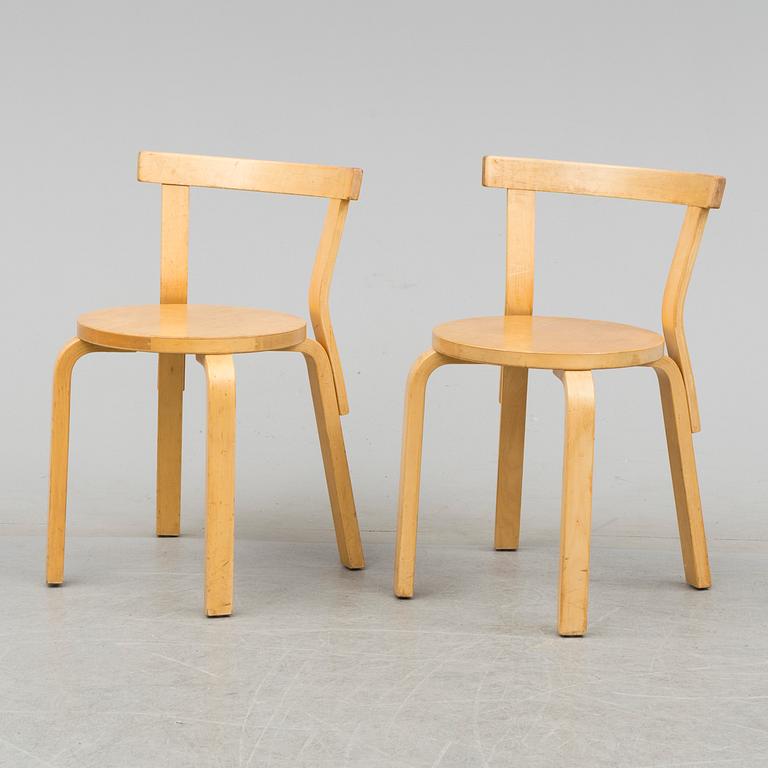 Nine model 68 chairs by Alvar Aalto, designed in 1935.