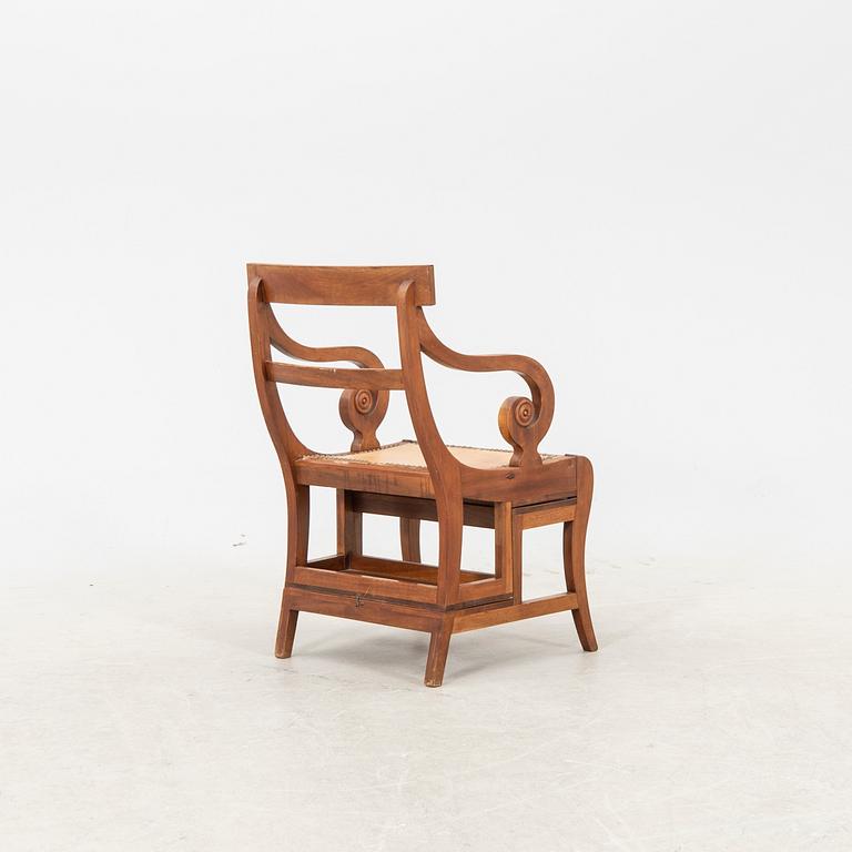 A late 20th century yew stepchair.
