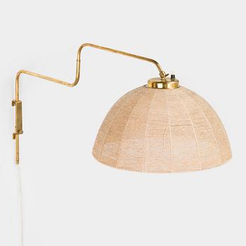 A mid-20th century wall light for Valinte, Finland.