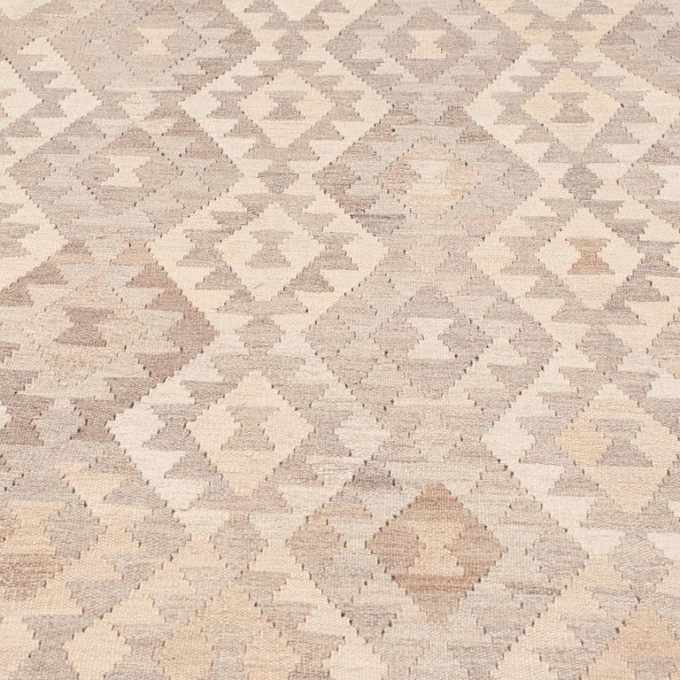 An oriental kilim, around 339 x 258 cm.