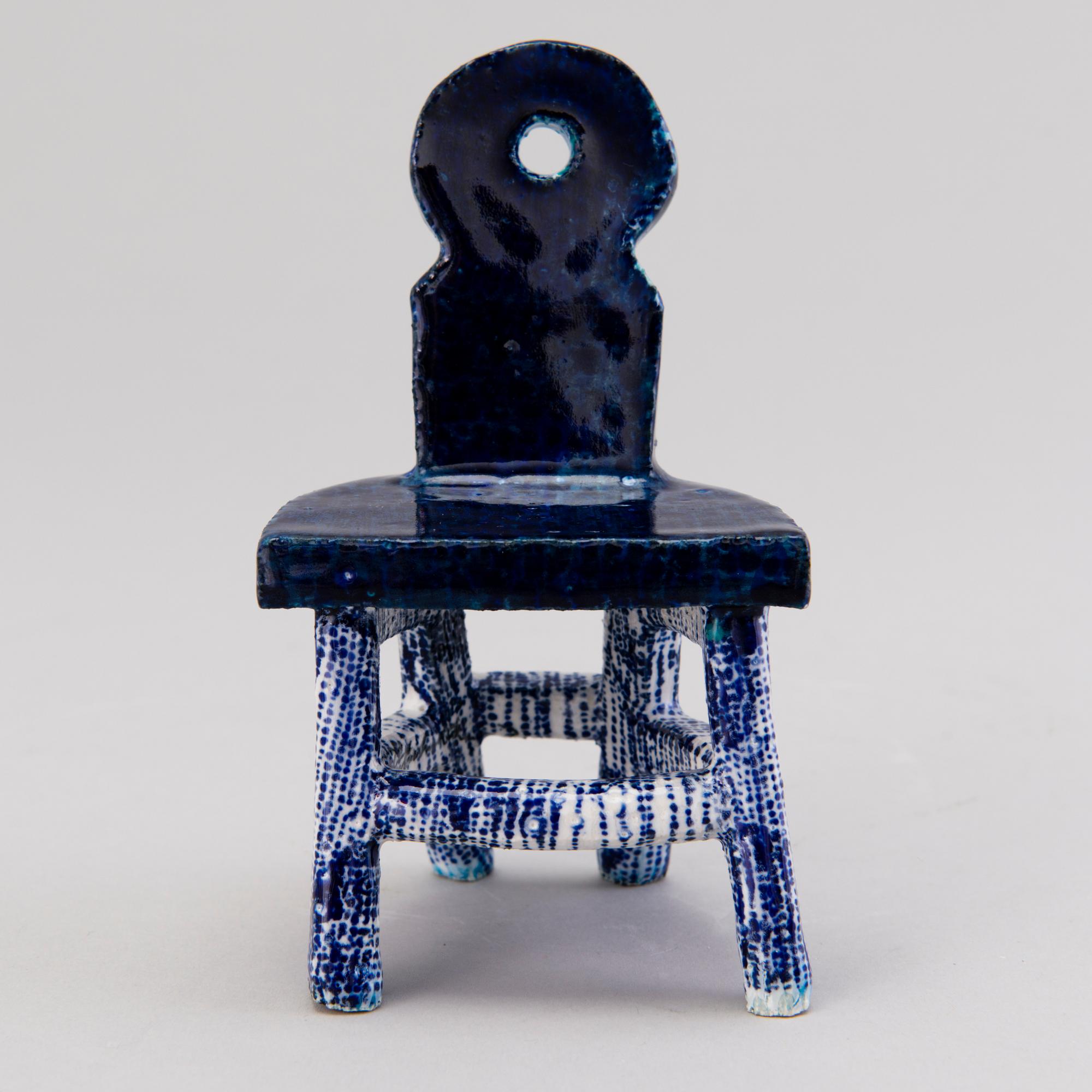 HEINI RIITAHUHTA, a porcelain miniature sculpture 'Chair' signed Heini Riitahuhta.