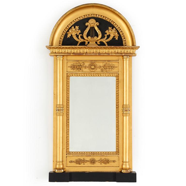 A 20th century Empire style gilt mirror.
