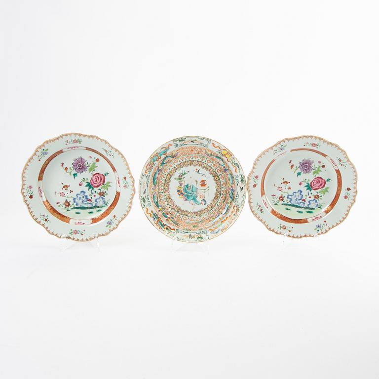 A set of three Chinese famille rose dinner plates, Qing dynasty, 18th Century. (2+1).