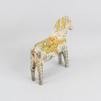 A painted Swedish wooden horse from the first half of the 20th century.