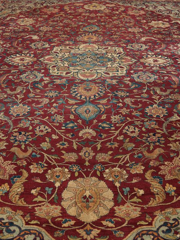 A CARPET, A semi-antique Esfahan part silk, ca 350,5 x 233,5 cm.