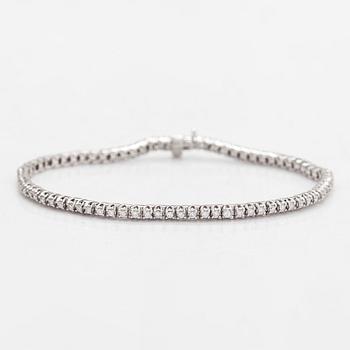 A 14K whitegold tennis bracelet, brilliant-cut diamonds totalling aprox. 1.12 ct according to engraving. Finnish marks.